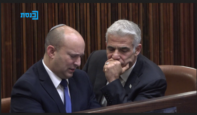 Yamina head Naftali Bennett and Yesh Atid leader Yair Lapid, who are trying to form a government to replace Benjamin Netanyahu, at the Knesset vote for president on Wednesday (Photo: The Knesset Channel)