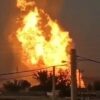 Fire rising from an oil pipeline that exploded in southern Iran