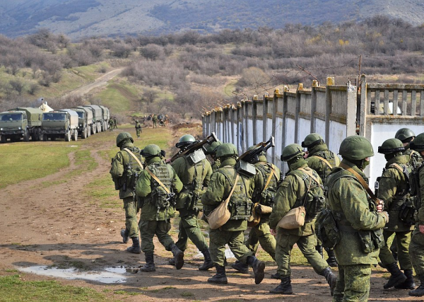 Little green men and lorries after the seizure of Perevalne military base, 9 March 2014 credit Anton Holoborodko- Wikipedia